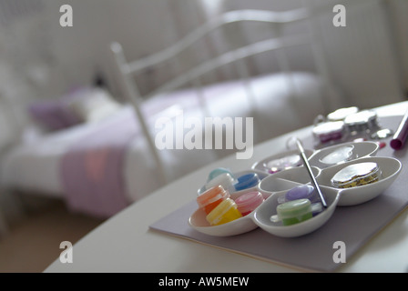 Paints and beads in a child’s bedroom Stock Photo