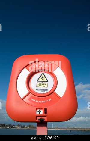 a red rescue ring on the side of edgbaston lake in birmingham Stock Photo