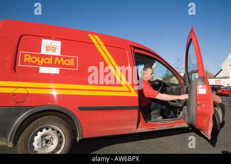 Postman post man working Red tee shirt GPO. Horizontal Narberth Post Office Red van car post bag facing Horizotal sunny blue Sky Stock Photo