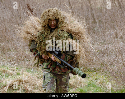 British Infantryman with a long range sniper rifle L115A3 which has a killing capability from over a mile. Stock Photo