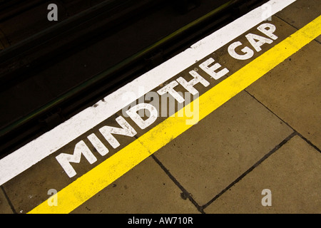 Mind the Gap sign on the edge of a London Underground Tube station's platform Stock Photo