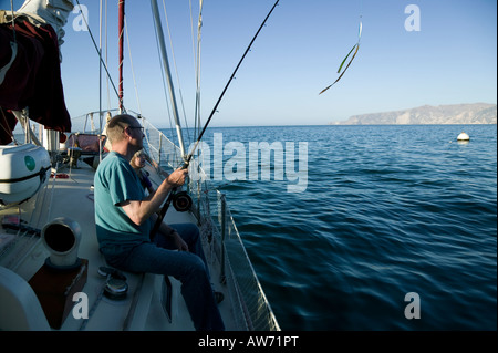 Dad and daughter fishing off a sailboat Santa Cruz Island Channel Islands, California, USA Stock Photo