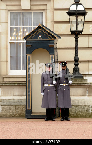 Guards in the Forecourt of Buckingham Palace London England Stock Photo