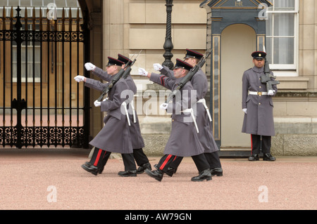 Guards in the Forecourt of Buckingham Palace London England Stock Photo