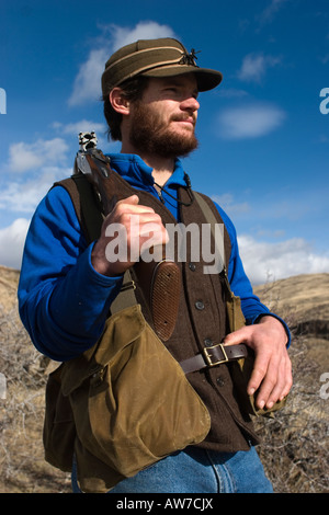 Man upland bird hunting for Alectoris Chukar, Idaho,  (MR). Stock Photo