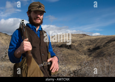 Man upland bird hunting for Alectoris Chukar, Idaho,  (MR). Stock Photo