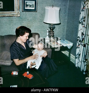 USA Portrait Mother Holding  Baby Boy, at Home in 'Living Room' Old Family Archives Vintage 1950s Retro Photo, lifestyle Stock Photo