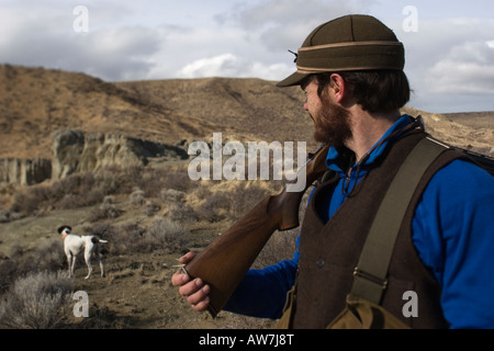 Man upland bird hunting for Alectoris Chukar, Idaho,  (MR). Stock Photo