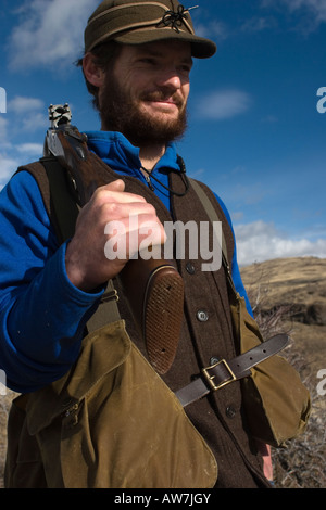 Man upland bird hunting for Alectoris Chukar, Idaho,  (MR). Stock Photo