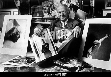 Society photographer 'Cecil Beaton' in his London studio with portraits including 'Edith Sitwell' and the Queen Stock Photo