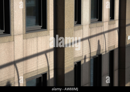 Shadow of person walking across Millennium Bridge London Stock Photo