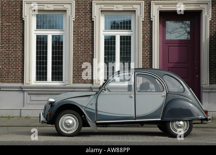citroen 2cv (deux chevaux) in attractive dark and light grey colour scheme parked by the roadside Stock Photo