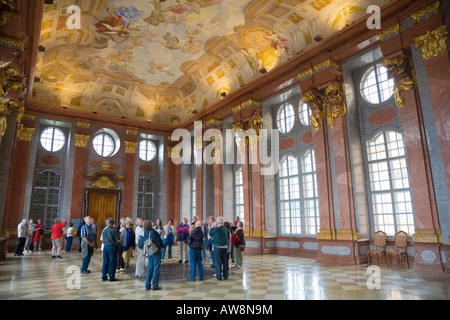 Tourists visiting the marble hall inside the baroque benedictine monastery of Melk Abbey in the Wachau region in Austria Stock Photo