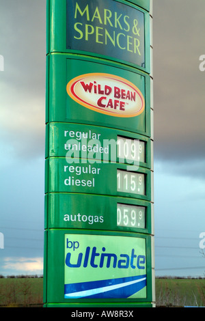 Fuel Prices Sign at BP Petrol Station with cafe and Marks Spencer Shop Stock Photo