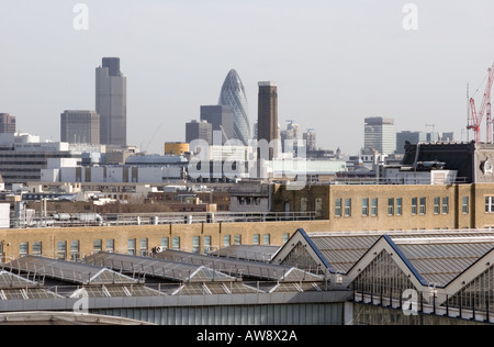 View across London roof tops taking in Waterloo Station, New tate, and The City of London buildings