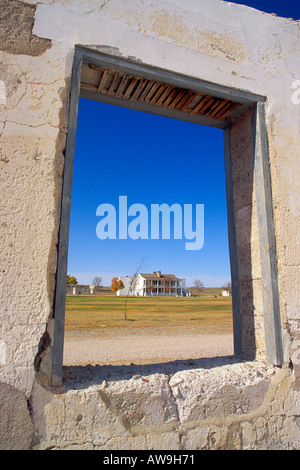 Officers barracks through a window in the ruins of the administration building Fort Laramie National Historic Site Wyoming Stock Photo