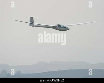 A modern high performance glider soaring in ridge lift Stock Photo