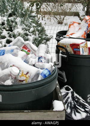 Recycling plastic bottles covered snow in the winter nobody recycle verical end of waste top view overhead hi-res Stock Photo