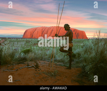 AU - Uluru-Kata Tjuta National Park:  Aborigine at Uluru  (formerly known as Ayers Rock) Stock Photo