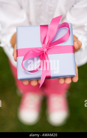 Closeup of a present in a childs hands Stock Photo