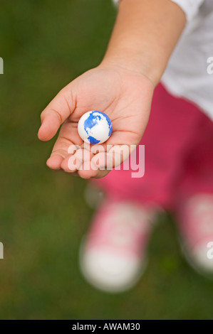 Closeup of earth in childs hand Stock Photo