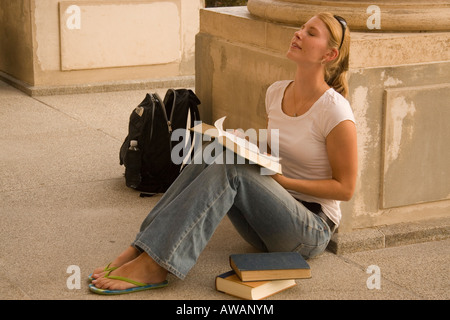 Young blonde female college student studying on campus Stock Photo