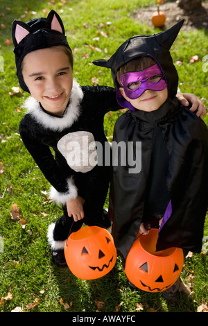 Boy and girl in Halloween costumes Stock Photo