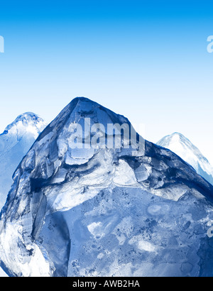 A group of ice cubes cleverly positioned to look like the peaks of some mountains. Stock Photo
