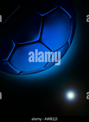 A blue football in space shot in a way to look like a planet Stock Photo