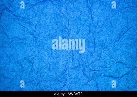 Crumpled colorful tissue paper on a blue tissue paper background Stock  Photo - Alamy