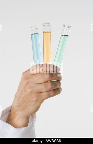 Hand holding test tubes Stock Photo