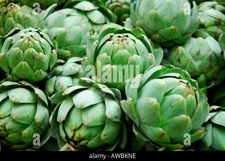 globe artichokes on market stall Stock Photo