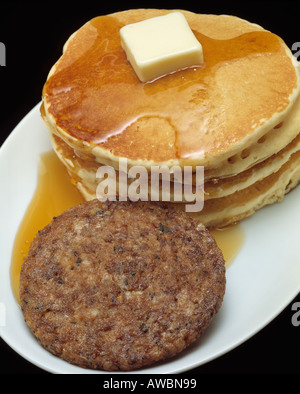 https://l450v.alamy.com/450v/awbn99/fast-food-hearty-breakfast-stack-of-pancakes-sausage-patty-melted-awbn99.jpg