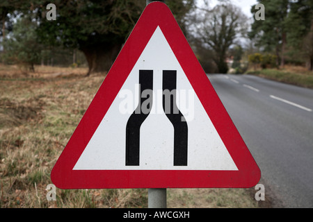 Road sign for road narrowing Stock Photo