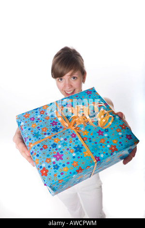 Woman holding a wrapped present Stock Photo