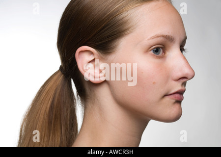 Portrait of long-haired woman with ponytail, profile Stock Photo