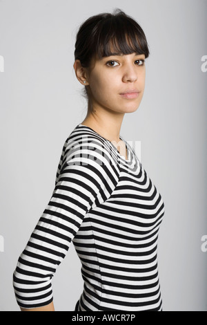 Young woman wearing a black-and-white striped top Stock Photo