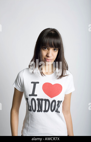 Young dark-haired woman with "I love London" T-shirt Stock Photo