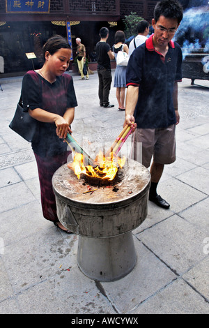 City God Temple, believers lighting joss sticks, old part of town, Shanghai, China, Asia Stock Photo