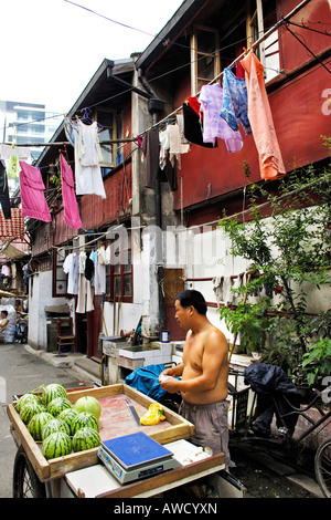 Old part of town, street scene, merchant selling melons, Shanghai, China, Asia Stock Photo