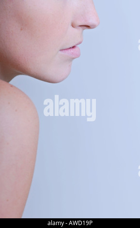 Young woman's profile, shoulder and partial face Stock Photo