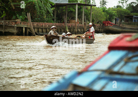 Boat Travelling Along Mekong River Stock Photo