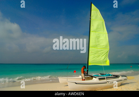 Man with sailboat on the beach at Cayo Largo, Cuba, Americas Stock Photo