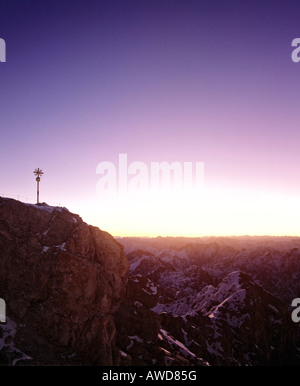Summit cross at 2962 m or 9718 ft on the Zugspitze, Germany's highest mountain, at dawn, Wetterstein Range, Werdenfels Region,  Stock Photo