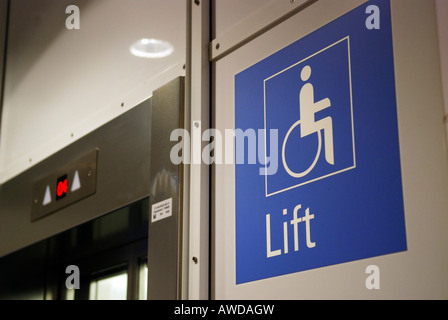 Sign 'Lift' and symbol with wheelchair for 'disabled people' Stock Photo