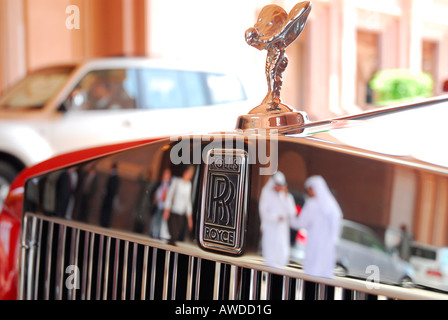 Sheikhs reflected on the chrome-plated grill of a Rolls Royce, Emirates Palace Hotel, Abu Dhabi, United Arab Emirates, Asia Stock Photo