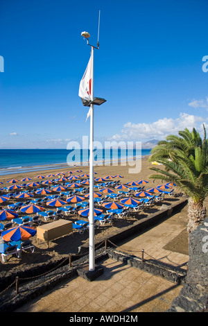 EARLY MORNING BEACH SCENE IN PLAYA DEL CARMEN LANZAROTE SPAIN Stock Photo