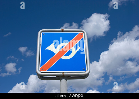 no honking allowed sign against blue sky Stock Photo