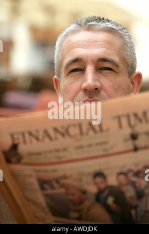 Businessman reading Financial Times Stock Photo