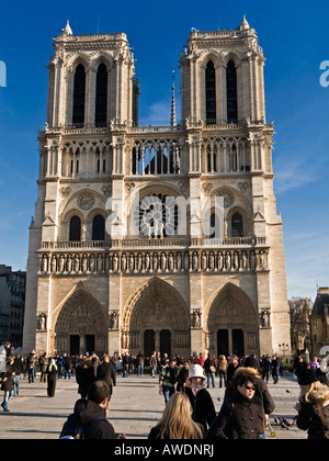Tourists at Notre Dame Cathedral, Paris in the autumn / winter, sightseeing Stock Photo